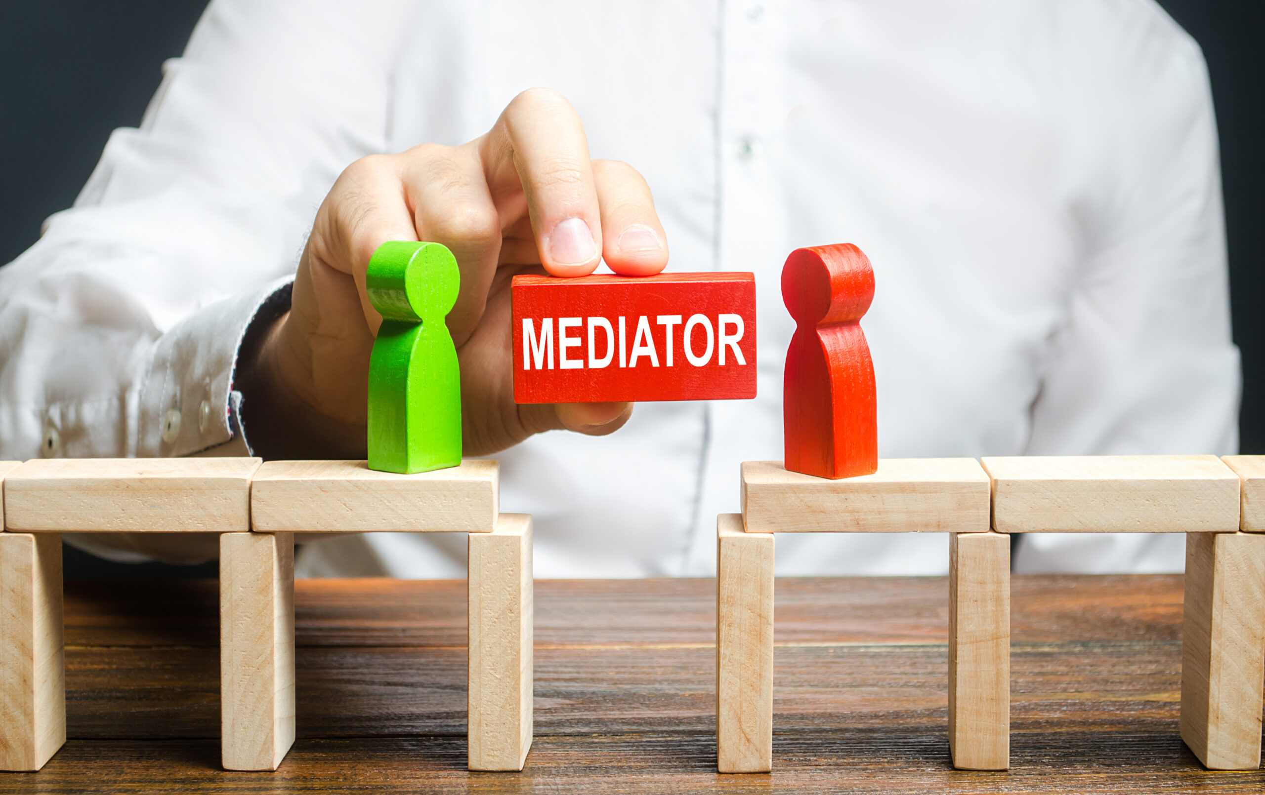 A,Man,Makes,Contact,Between,People,Opponents.,Arbitrator,And,Mediator.